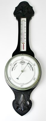 Lot 113 - A wooden cased banjo barometer with...