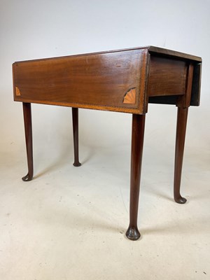 Lot 549 - A mahogany drop leaf-table with inlaid detail,...
