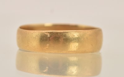 Lot 1356 - An 18ct yellow gold band ring, size N, approx...