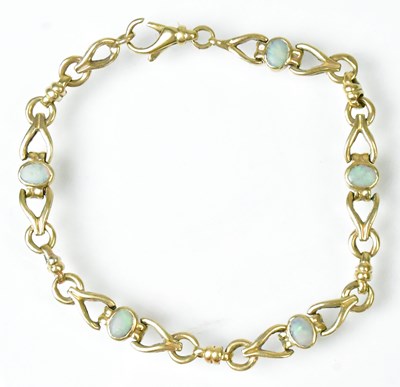 Lot 770 - A 9ct gold fancy link bracelet set with five...