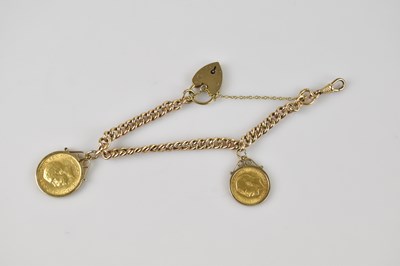 Lot 65 - A yellow metal curb link bracelet set with a...