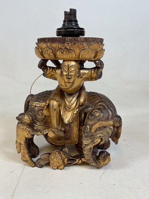 Lot 639 - A carved gilded hardwood elephant lamp