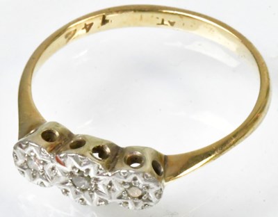 Lot 761 - A yellow metal ring set with three illusion...