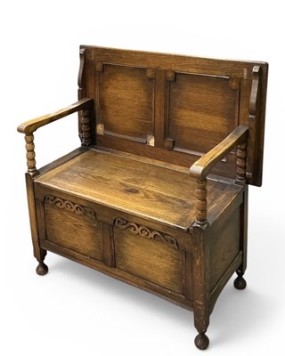 Lot 47 - An early 20th century carved oak monk’s bench,...