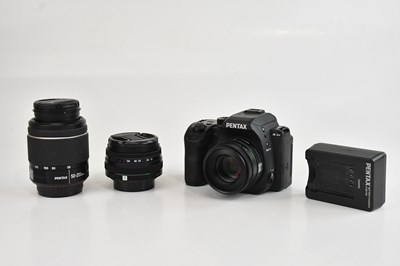 Lot 1324 - PENTAX; a KS-2 DSLR camera, with three lenses,...