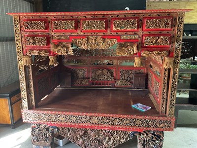 Lot 772 - A red and gold and painted lacquered opium bed,...