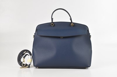 Lot 1434 - FURLA; a blue pebbled leather My Piper top...