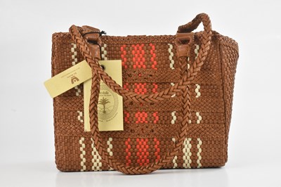 Lot 1441 - EN SHALLA; a cognac, cream, and orange leather...