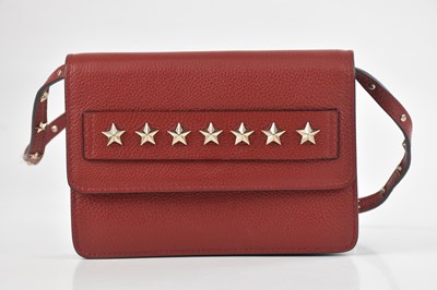 Lot 1430 - VALENTINO RED; a red pebbled leather, star...