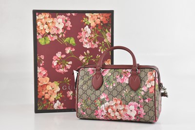 Lot 1407 - GUCCI; a floral print burgundy and pink...