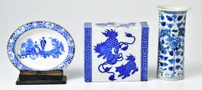 Lot 261 - A Chinese blue and white ceramic opium pillow,...