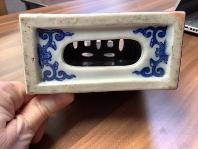 Lot 261 - A Chinese blue and white ceramic opium pillow,...