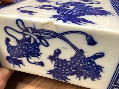 Lot 261 - A Chinese blue and white ceramic opium pillow,...