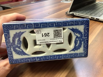 Lot 261 - A Chinese blue and white ceramic opium pillow,...