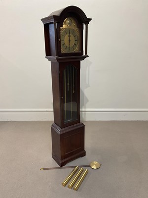 Lot 1176 - ENGLISH ELEGANCE; a modern mahogany longcase...