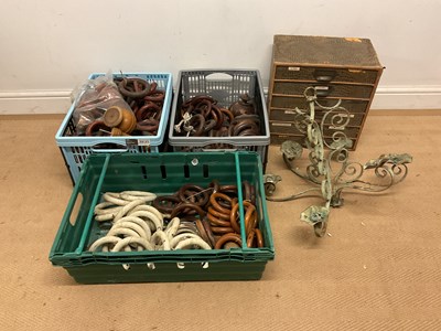 Lot 35 - Three crates of mahogany curtains rings,...