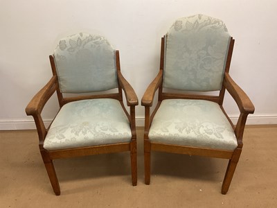Lot 857 - Two upholstered oak chairs, comprising a high...