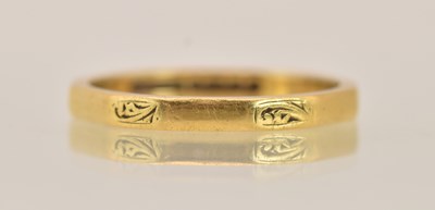 Lot 1347 - A 22ct yellow gold thin band ring with faceted...