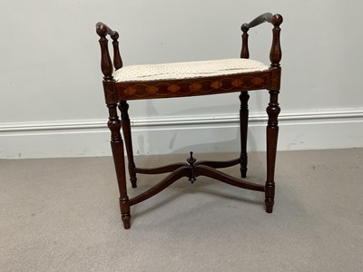 Lot 1149 - An Edwardian inlaid mahogany piano stool, on...