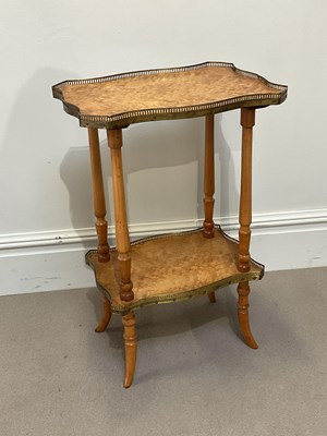 Lot 1099 - A Continental maple two tier etagere with gilt...