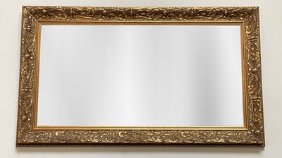 Lot 1025 - A modern Art Nouveau style wall mirror, with...