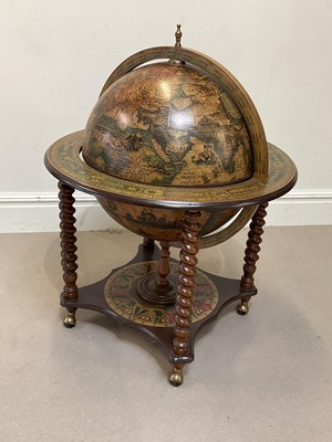 Lot 1061 - A modern globe drinks cabinet, with under tier,...