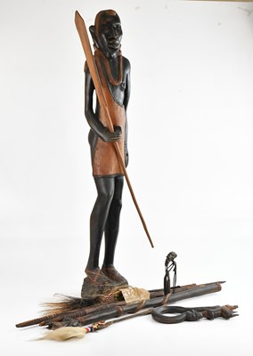 Lot 1363 - A West African carved hardwood figure, height...