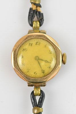 Lot 1116 - A 9ct gold wristwatch with leather strap,...
