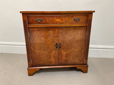 Lot 1072 - A reproduction burr walnut cabinet, with a...