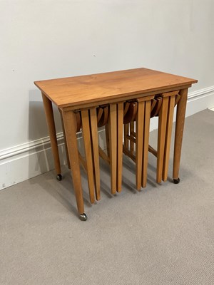 Lot 1019 - A mid century teak occasional table, with four...