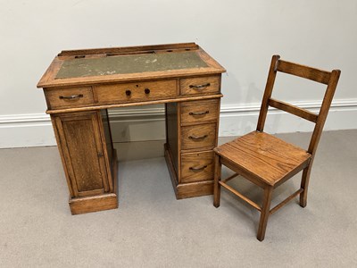 Lot 1042 - An early to mid 20th century oak child's...