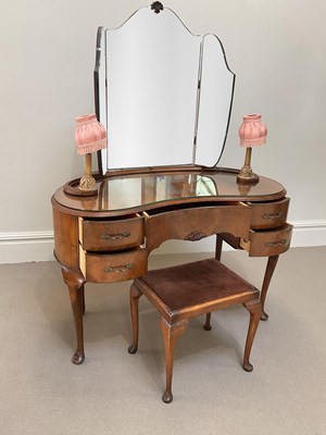 Lot 1119 - A 1940s walnut kidney shaped dressing table,...