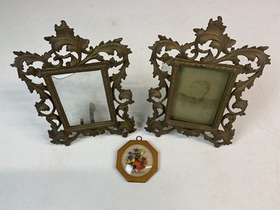 Lot 421 - A pair of brass Victorian table picture frames,...