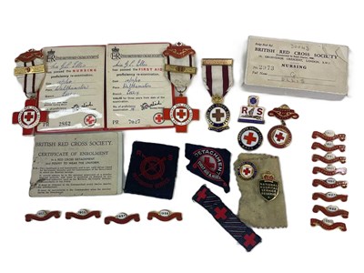 Lot 189 - A small group of Red Cross medals and badges,...