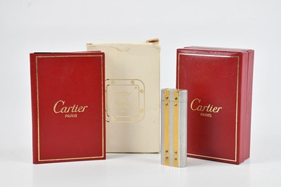 Lot 1199 - CARTIER; a stainless steel and gold plated...