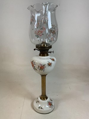 Lot 640 - A ceramic oil lamp, with fluted pillar and...