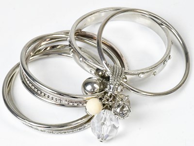 Lot 780 - ERICKSON BEAMON: a seven-piece bangle bracelet,...