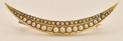 Lot 1504 - A yellow gold crescent brooch, with double row...