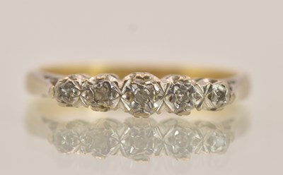Lot 1383 - An 18ct yellow gold diamond set ring, the five...