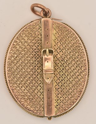 Lot 1457 - A 9ct rose gold oval locket within an oval...