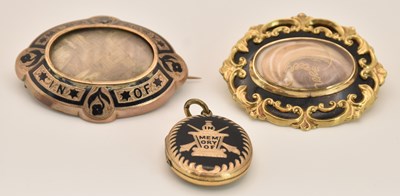 Lot 1507 - Two gold coloured metal mourning brooches, one...