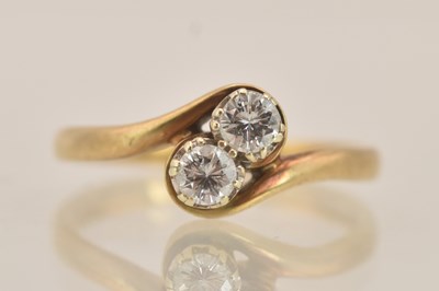 Lot 1410 - A 9ct yellow gold diamond set ring, with two...