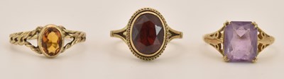 Lot 1402 - Three 9ct yellow gold dress rings, one with...