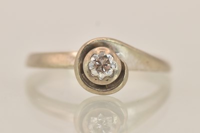 Lot 1379 - An 18ct white gold illusion set diamond ring...