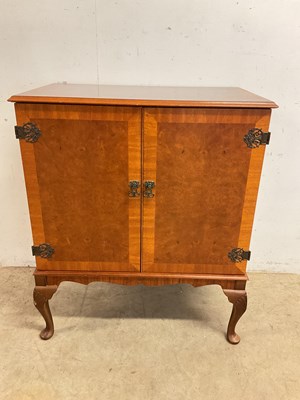 Lot 563 - A two door walnut cabinet, height 92cm, width...
