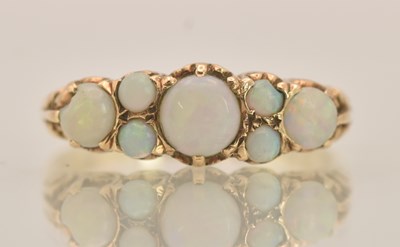 Lot 1327 - A 9ct yellow gold opal set ring, the top set...