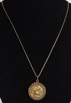 Lot 1437 - A Chinese yellow gold dragon pendant with...