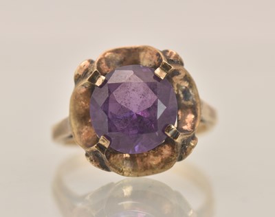 Lot 1415 - A yellow gold dress ring with central claw set...