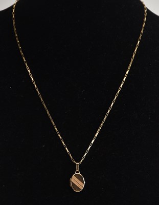 Lot 1461 - A 9ct yellow gold dainty necklace with ring...