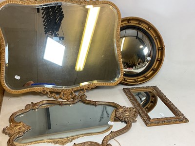 Lot 724 - Four small mirrors, including a shaped...